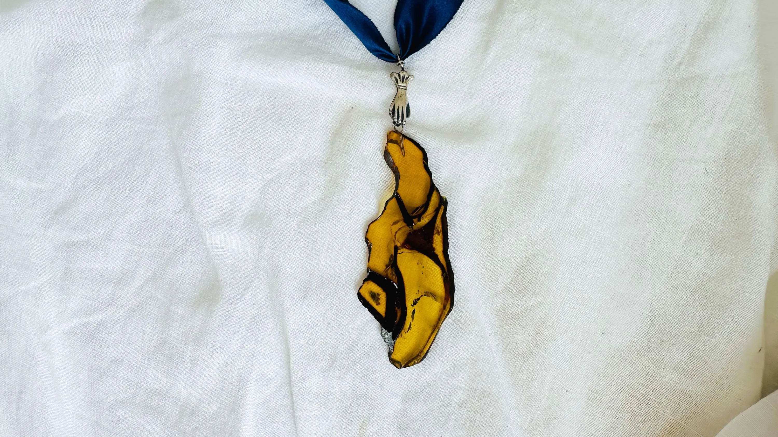 Large Amber Pendant on a Silk Ribbon. 2422