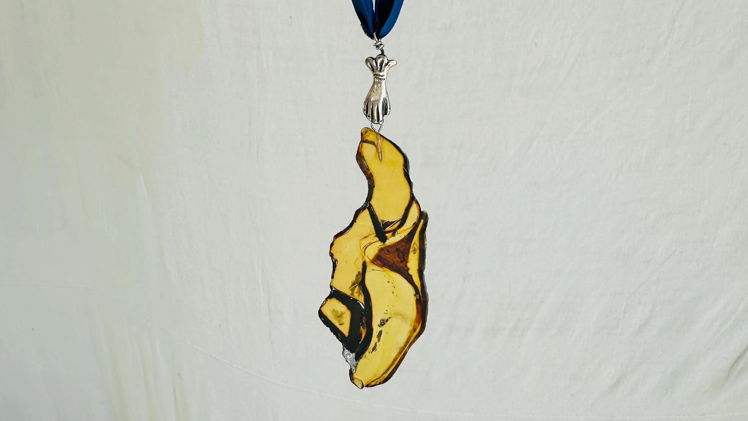 Large Amber Pendant on a Silk Ribbon. 2422