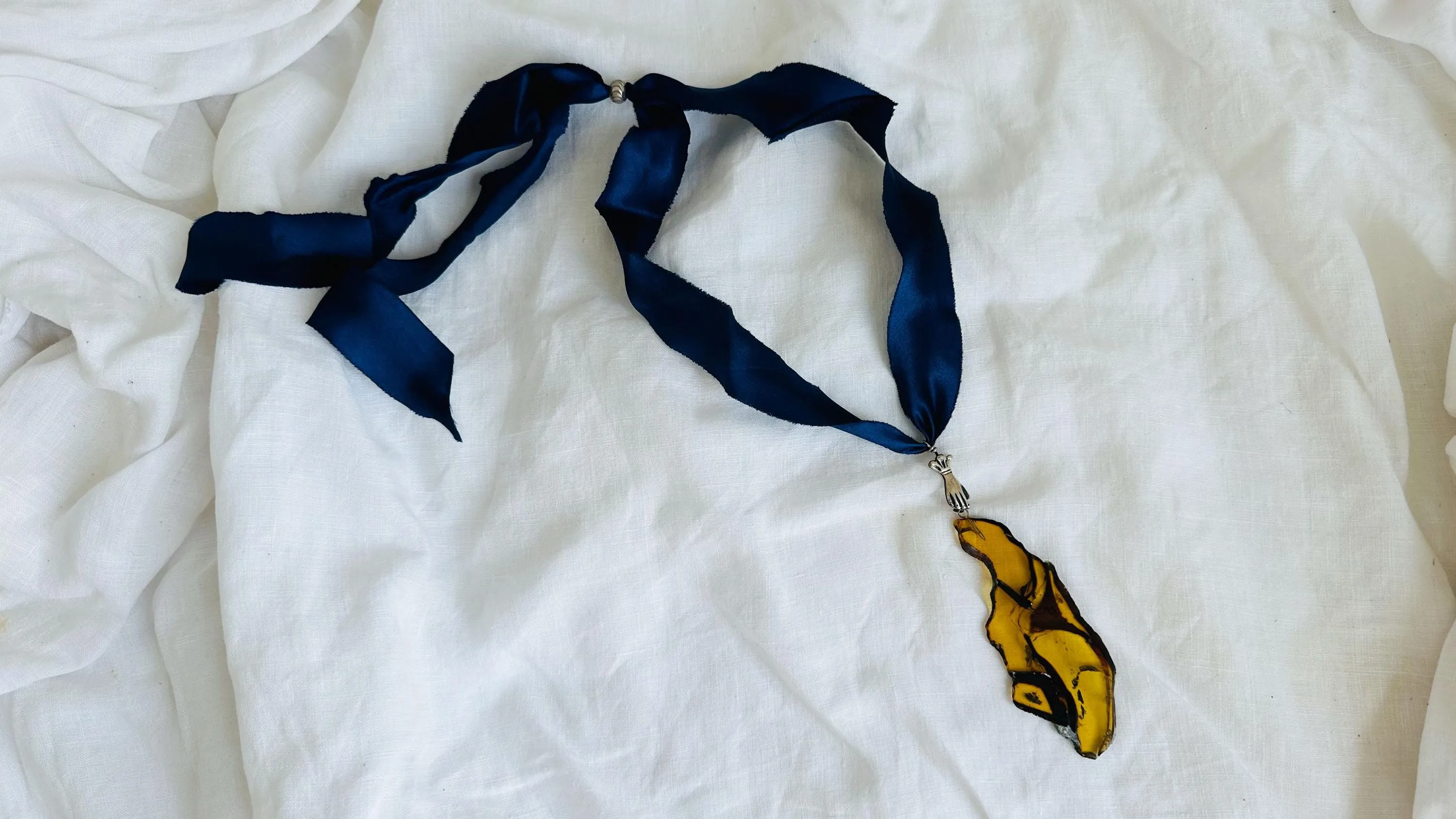 Large Amber Pendant on a Silk Ribbon. 2422